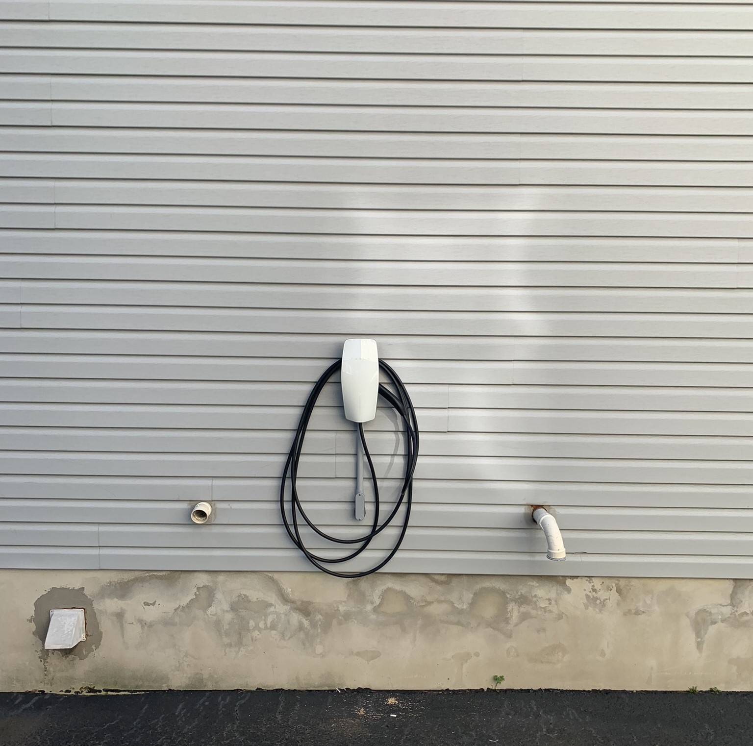 compact ev charger at a residential home