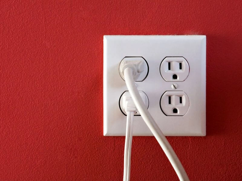 electrical-outlet-power-4-sockets-red-wall