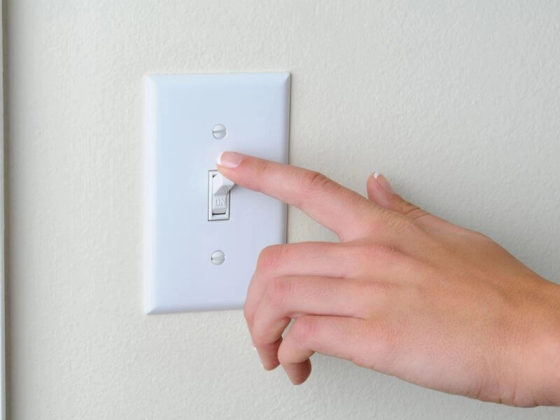 turning off white light switch on wall