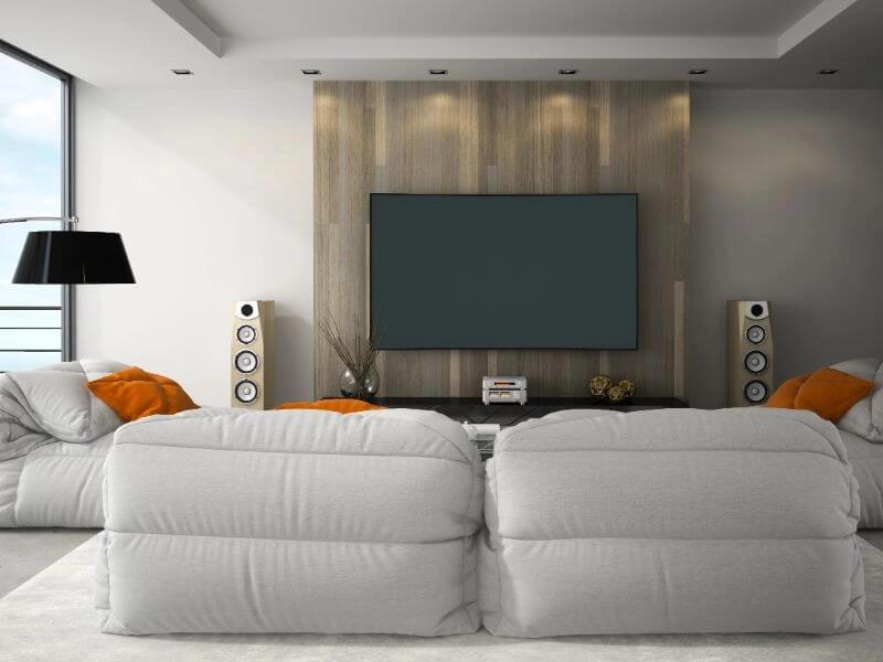 flat screen hd tv hung on wall with audio system