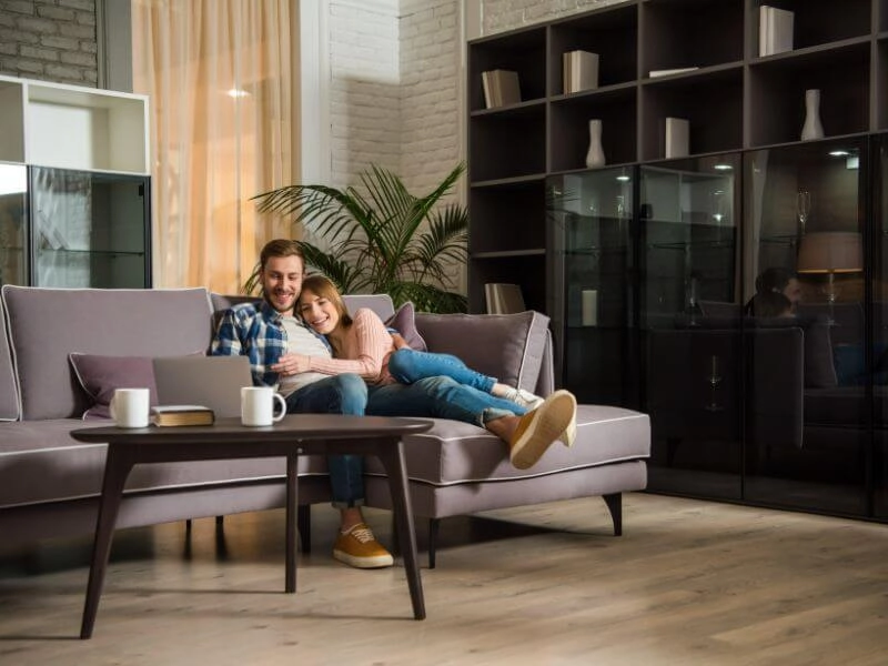 man-woman-watching-movie-in-home